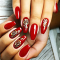 Red nail polish with gold rose designs on a neutral background, Obroi