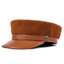 Brown suede cap with leather band and star emblem on a white background, Obroi