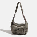 Green shoulder bag with brown strap on a white background, Obroi
