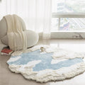Round cloud-patterned rug on a light wooden floor with a chair and window in the background, Obroi