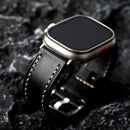 Obroi Smartwatch with a black leather strap on a dark textured background