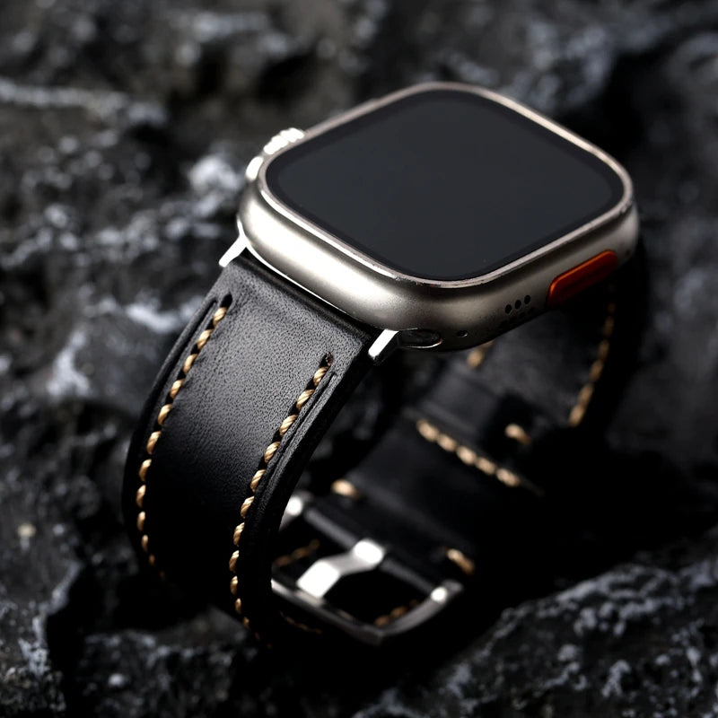 Obroi Smartwatch with a black leather strap on a dark textured background