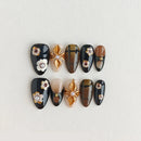 Set of handmade nails with decorative elements on a light gray background, Obroi