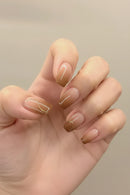 Hand with gradient nail polish on a neutral background, Obroi