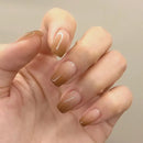 Hand with gradient nail polish on a neutral background, Obroi