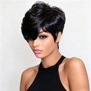 A woman modeling a short, layered black wig with textured styling against a plain light background, Obroi