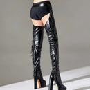 Black leather thigh-high boots with fringe details on a neutral background, Obroi