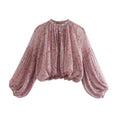 Obroi Floral blouse with puffed sleeves on a white background