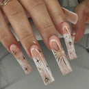 Nails with decorative designs on a neutral background, Obroi