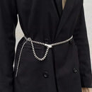 Black coat with a silver belt featuring a snake design on a neutral background, Obroi