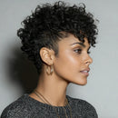 Woman with styled black hair against a gray background, Obroi