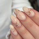 Nails with starfish and pearl decorations on a neutral background, Obroi