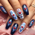 Nails with floral and heart designs on a pink fabric background, Obroi