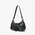 Black leather handbag on a light gray background, Obroi