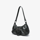Black leather handbag on a light gray background, Obroi