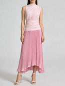 Woman wearing a pink pleated dress on a white background, Obroi