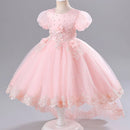 Pink children's dress on a mannequin against a gray background, Obroi
