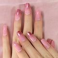 Close-up of hands with pink and glittery nails on a pink fabric background, Obroi