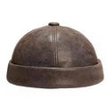 Brown leather cap on a white background, Obroi