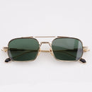Gold-framed sunglasses with green lenses on a white background, Obroi