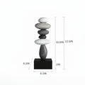 A black rectangular pedestal with a stacked stone sculpture on top, shown with dimension lines and measurements including 10.6 inches, 12, Obroi