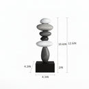 A black rectangular pedestal with a stacked stone sculpture on top, shown with dimension lines and measurements including 10.6 inches, 12, Obroi