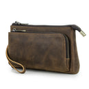 Brown leather clutch bag with multiple zippers on a white background