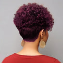 Person with curly purple hair wearing gold earrings against a gray background, Obroi