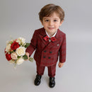Child in a red plaid suit holding flowers on a white background, Obroi