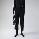 Person wearing a black outfit with a handbag on a white background, Obroi