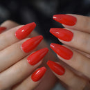 Close-up of hands with bright red nail polish on a blurred background, Obroi