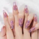 Hand with pink and purple gradient nails on a white background, Obroi