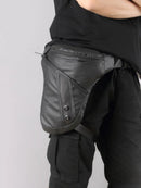 Black leather waist bag worn by a person on a plain background, Obroi