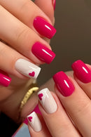 Nails with pink and white design, featuring heart shapes, Obroi