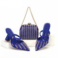 Blue high-heeled shoes and matching handbag with gold accents on a white background, featuring the brand 'Obroi'.