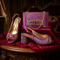 Purple high-heeled shoes with embellishments and a matching handbag on a red velvet surface, Obroi