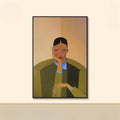 Framed artwork of a person wearing a green jacket on a beige wall, Obroi