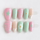Set of pastel-colored nail art designs on a white background, Obroi