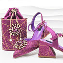 Purple high-heeled shoes and matching handbag with decorative elements on a white background, Obroi