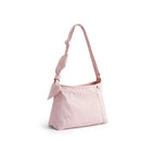 Pink handbag with a bow detail on a white background, featuring the Obroi brand.