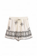 White shorts with black embroidery on a white background, Obroi