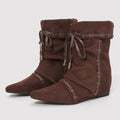 Brown suede wedge boots with decorative laces on a light gray background, Obroi