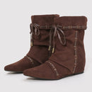 Brown suede wedge boots with decorative laces on a light gray background, Obroi