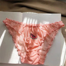 Pink lace underwear with watermelon design on a white surface, Obroi