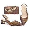 Brown high-heeled shoes with gold embellishments and matching clutch on a white background, Obroi