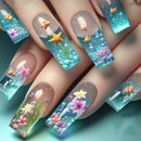 Nail art design with fish, flowers, and underwater elements on a teal background, Obroi