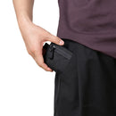 Person holding a black wallet with a white background, Obroi