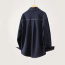 Dark denim jacket on a mannequin against a light background, Obroi
