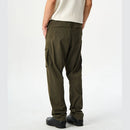 Person wearing olive green cargo pants on a white background, Obroi