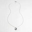 Silver necklace with a heart-shaped pendant on a white background, Obroi